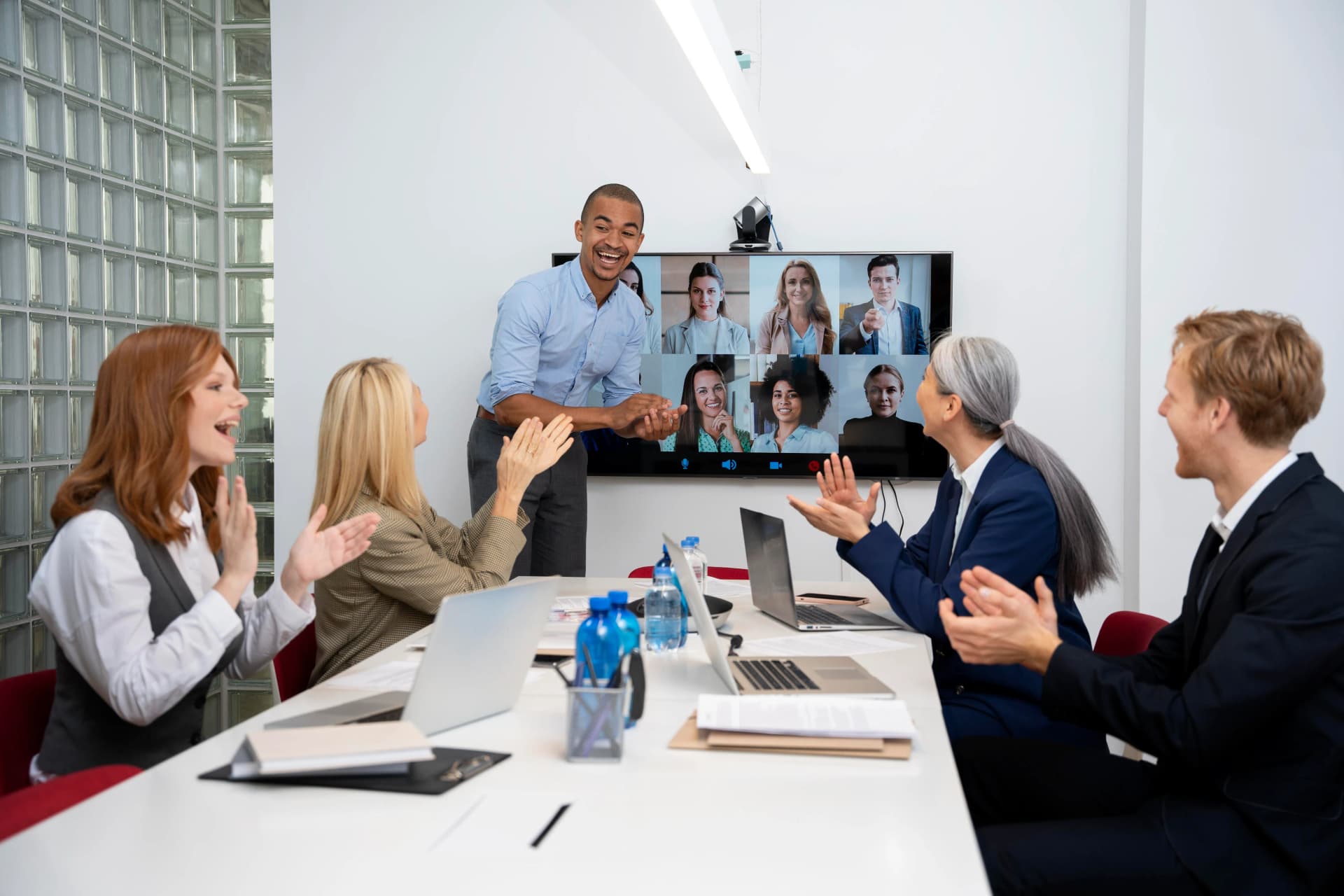 A diverse group of working professionals attending an online Executive MBA lecture.